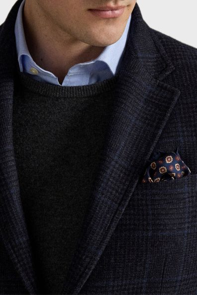 Чоловічий піджак в клітинку